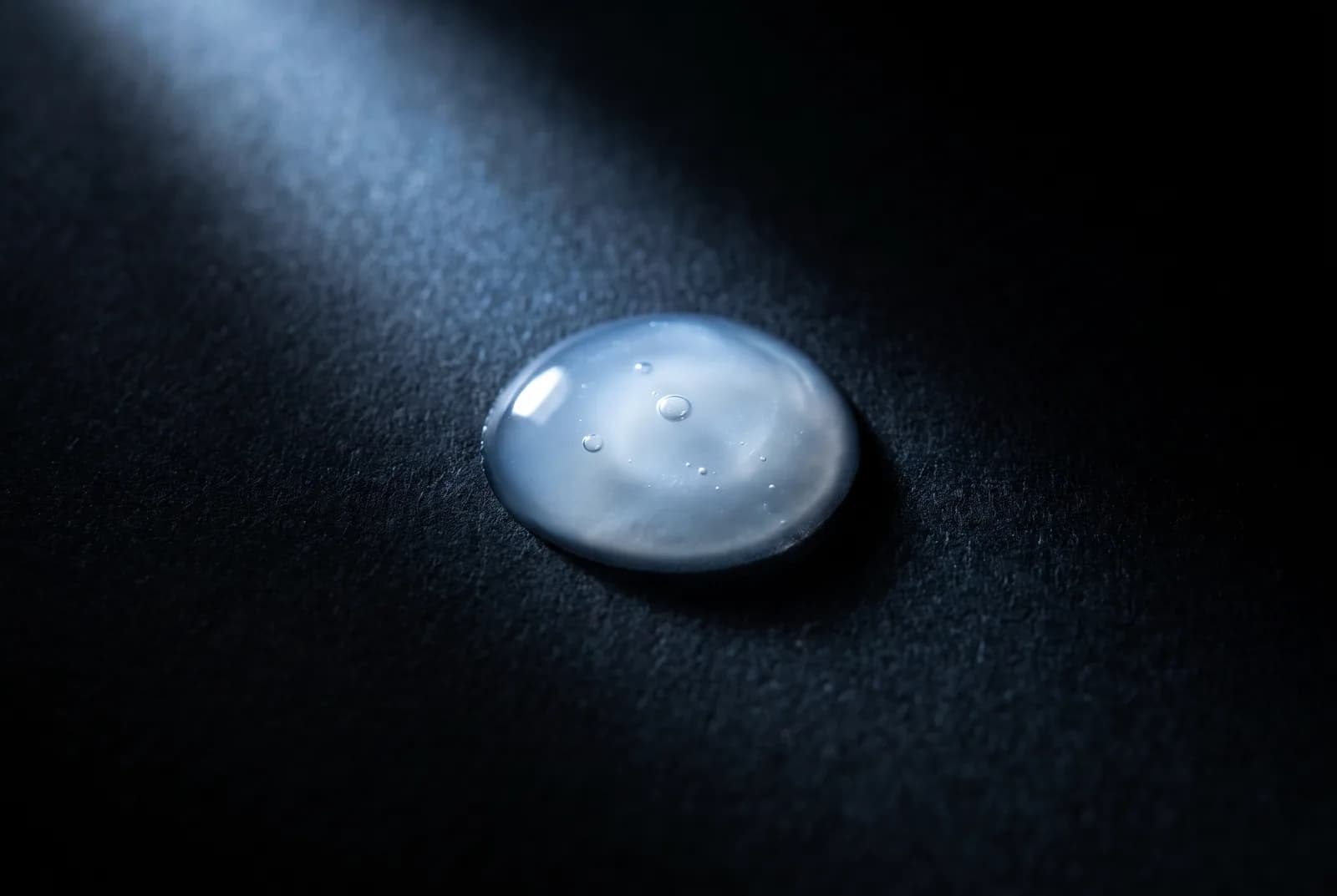 A drop of serum on black